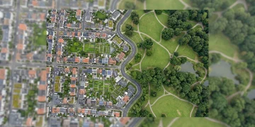 Aerial view of a city district transitioning into a green park, illustrating economic and social shifts.